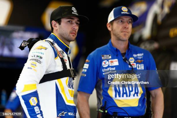 Chase Elliott, driver of the NAPA Auto Parts Chevrolet, and crew chief Alan Gustafson meet in the garage area during practice for the NASCAR Cup...