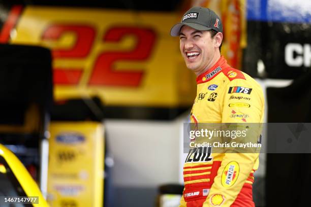 Joey Logano, driver of the Shell Pennzoil Ford, laughs in the garage area during practice for the NASCAR Cup Series 65th Annual Daytona 500 at...