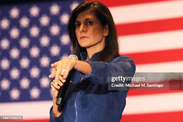 Republican presidential candidate Nikki Haley points at an attendee as she answers questions during a campaign event in the New Hampshire Institute...