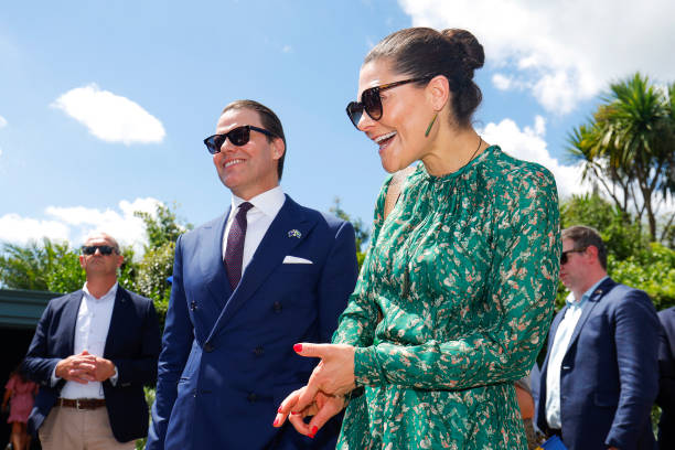 crown-princess-victoria-of-sweden-and-prince-daniel-of-sweden-react-as-they-are-greeted-by-a.jpg