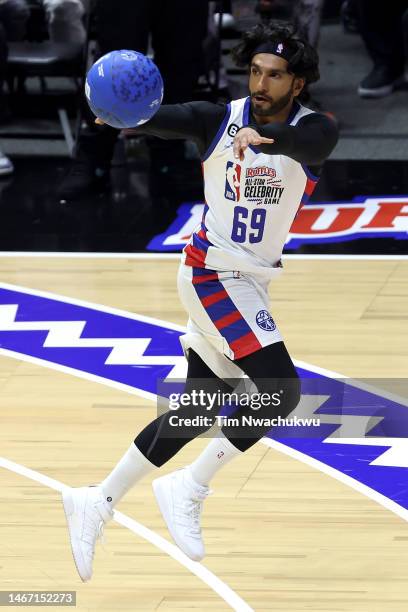 Actor Ranveer Singh of Team Dwayne passes the ball against Team Ryan during the first quarter in the 2023 NBA All Star Ruffles Celebrity Game at...