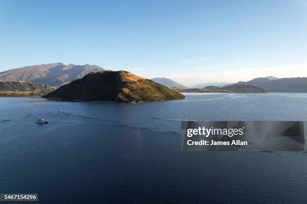 In an aerial view, swimmers compete in Lake Wanaka during the 2023 Challenge Wanaka on February 18, 2023 in Wanaka, New Zealand.