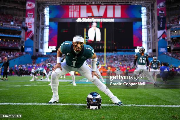 Jalen Hurts of the Philadelphia Eagles warms up against the Kansas City Chiefs after Super Bowl LVII at State Farm Stadium on February 12, 2023 in...
