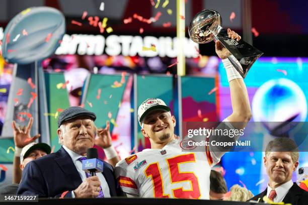 Patrick Mahomes of the Kansas City Chiefs hoists the Lombardi Trophy against the Philadelphia Eagles after Super Bowl LVII at State Farm Stadium on...