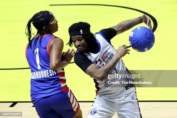 Rapper 21 Savage of Team Dwayne steals the ball from basketball player Diamond DeShields of Team Ryan during the second quarter in the 2023 NBA All...