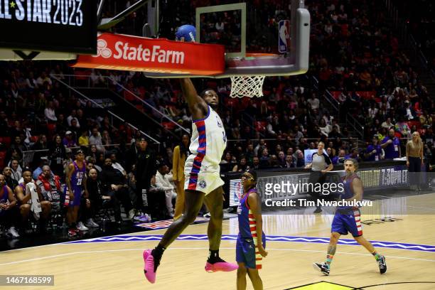 Football player DK Metcalf of Team Dwayne dunks the ball against Team Ryan during the third quarter in the 2023 NBA All Star Ruffles Celebrity Game...