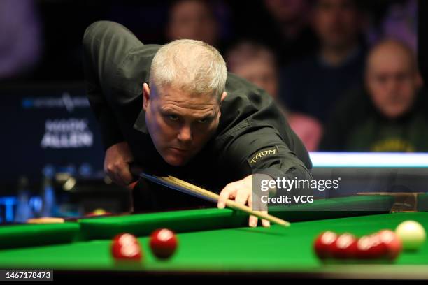 Robert Milkins of England plays a shot in the quarterfinal match against Mark Allen of Northern Ireland on day five of 2023 Betvictor Welsh Open at...