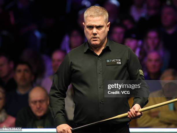 Robert Milkins of England reacts in the quarterfinal match against Mark Allen of Northern Ireland on day five of 2023 Betvictor Welsh Open at Venue...