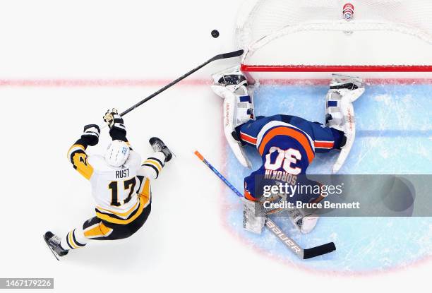 Bryan Rust of the Pittsburgh Penguins is stopped by Ilya Sorokin of the New York Islanders during the second period at UBS Arena on February 17, 2023...