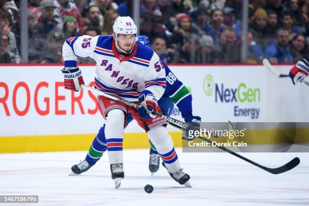 Ryan Lindgren of the New York Rangers skates with the puck during the first period of their NHL game against the Vancouver Canucks at Rogers Arena on...