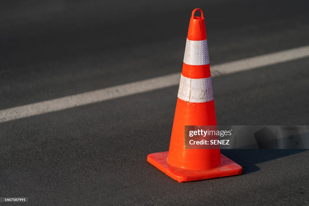 Traffic cone,an image of cautions on asphalt road