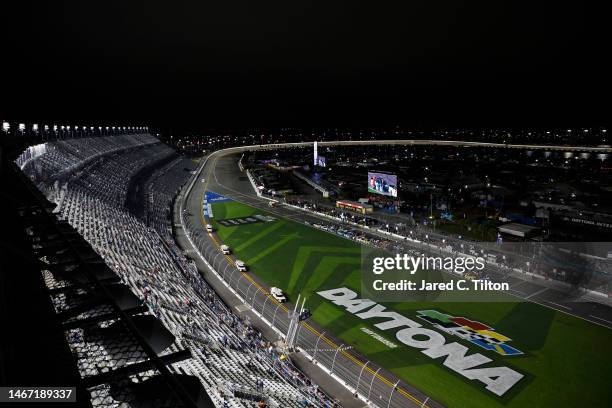 Track Drying Team works to dry the track during a weather delay in the NASCAR Craftsman Truck Series NextEra Energy 250 at Daytona International...