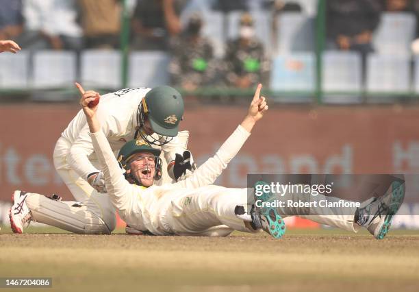 Peter Handscomb of Australia celebrates taking a catch to dismiss Shreyas Iyer of India during day two of the Second Test match in the series between...