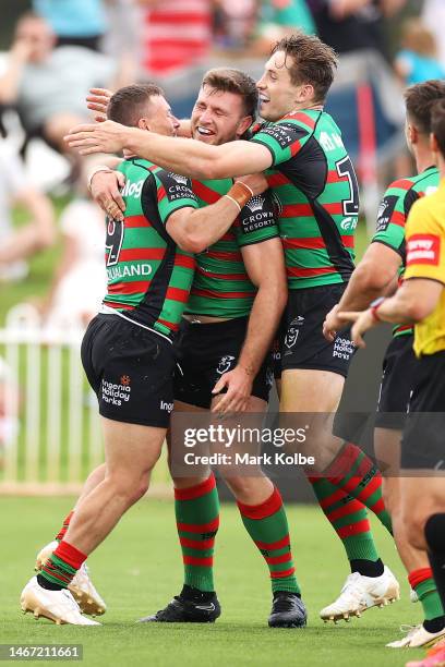 Jai Arrow of the Rabbitohs celebrates with his team mates after scoring a try during the NRL Trial and Charity Shield match between St George...