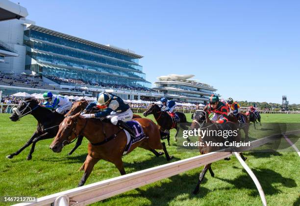 Jamie Kah riding Coolangatta defeats Luke Nolen riding I Wish I Win in race 7, the Black Caviar Lightning, during Melbourne Racing at Flemington...