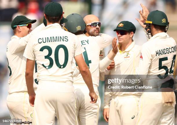 Nathan Lyon of Australia celebrates taking the wicket of KS Bharat of India during day two of the Second Test match in the series between India and...