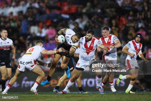 James Fisher-Harris of the Panthers is tackled during the World Club Challenge and NRL Trial Match between the Penrith Panthers and St Helens at...