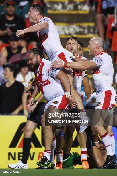 Konrad Hurrell of the Saints celebrates scoring a try with team mates during the World Club Challenge and NRL Trial Match between the Penrith...