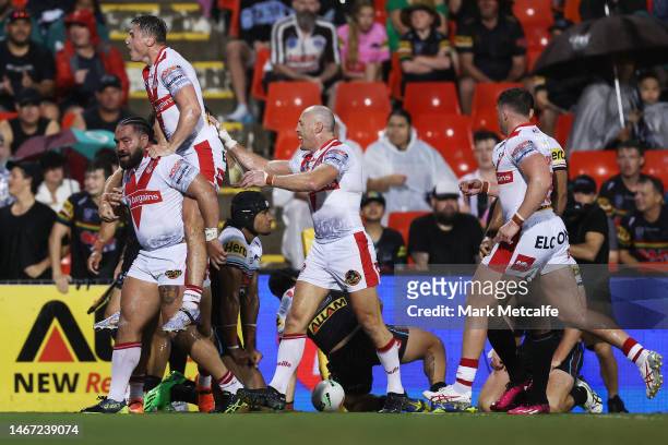 Konrad Hurrell of the Saintscelebrates scoring a try with team mates during the World Club Challenge and NRL Trial Match between the Penrith Panthers...
