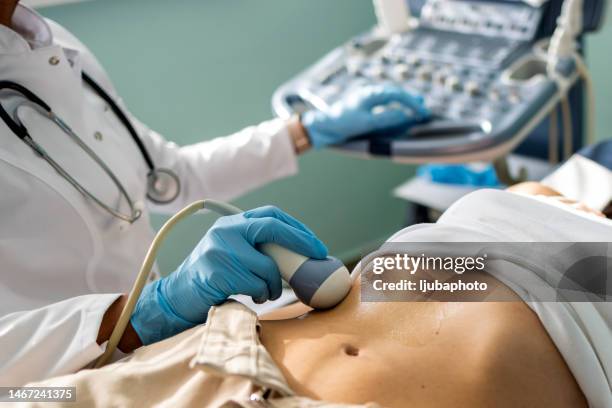 doctor examining woman with ultrasound - ultraljud bildbanksfoton och bilder