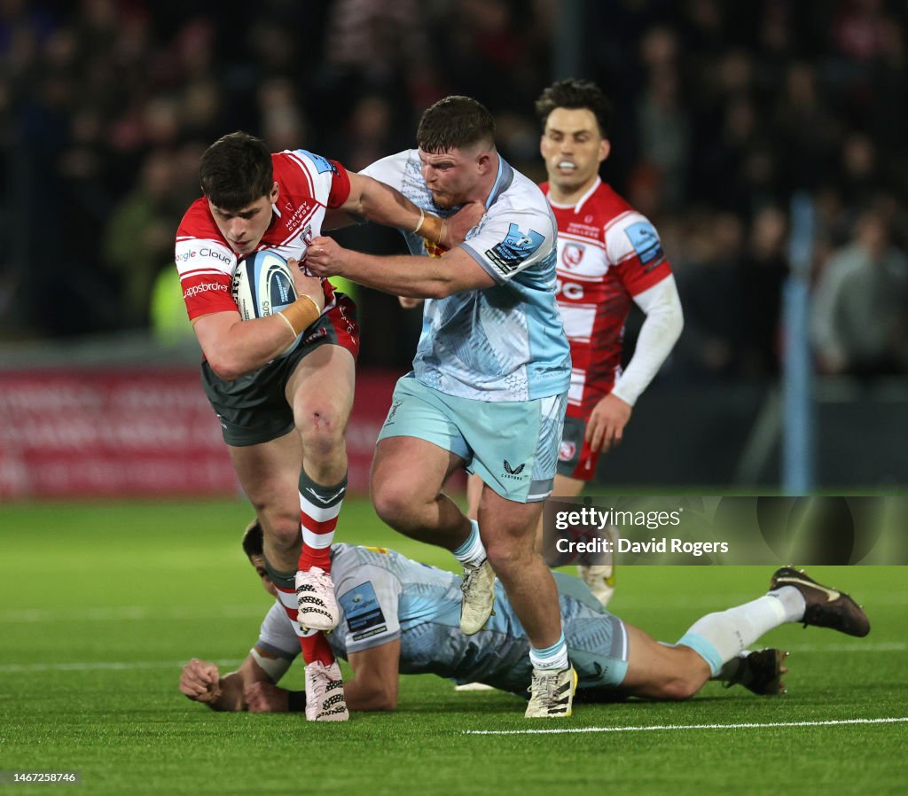 Seb Atkinson of Gloucester holds off Jack Musk as he charges upfield ...