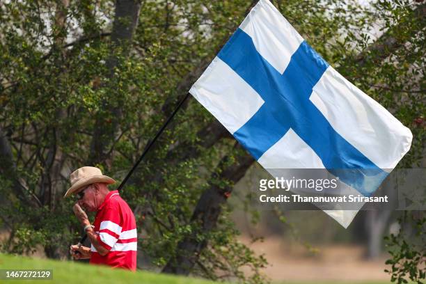The fan with the Finland flag walks during Day Three of the Thailand Classic at Amata Spring Country Club on February 18, 2023 in Thailand.
