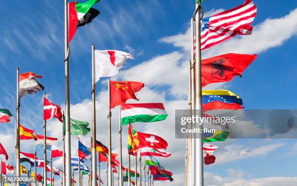 many different national flags - international flags stock-fotos und bilder