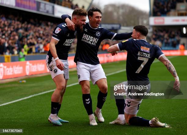 Tom Bradshaw of Millwall celebrates with Danny McNamara and Oliver Burke of Millwall after scoring his side's first goal during the Sky Bet...