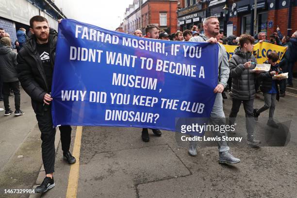 General view as fans of Everton, holding a banner which reads 'Farhad Moshiri, If You Didnt Want To Become A Museum, Why Did You Keep The Club...
