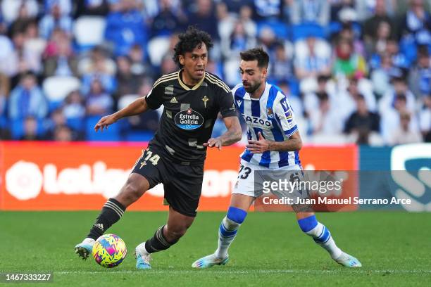 Renato Tapia of RC Celta is put under pressure by Brais Mendez of Real Sociedad during the LaLiga Santander match between Real Sociedad and RC Celta...