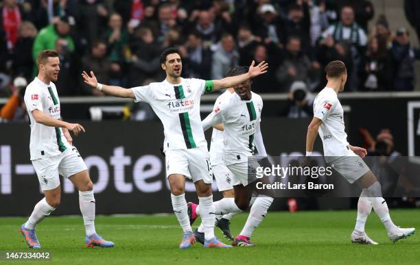 Lars Stindl of Borussia Moenchengladbach celebrates with teammates after scoring the team's first goal during the Bundesliga match between Borussia...
