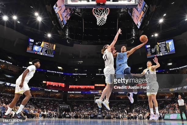Desmond Bane of the Memphis Grizzlies goes to the basket against Kelly Olynyk of the Utah Jazz during the game at FedExForum on February 15, 2023 in...