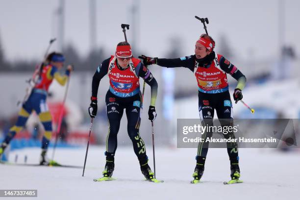 Sophia Schneider of Germany changes over to Denise Herrmann-Wick of Germany in the last exchange during the Women 4x6 km Relay at the IBU World...