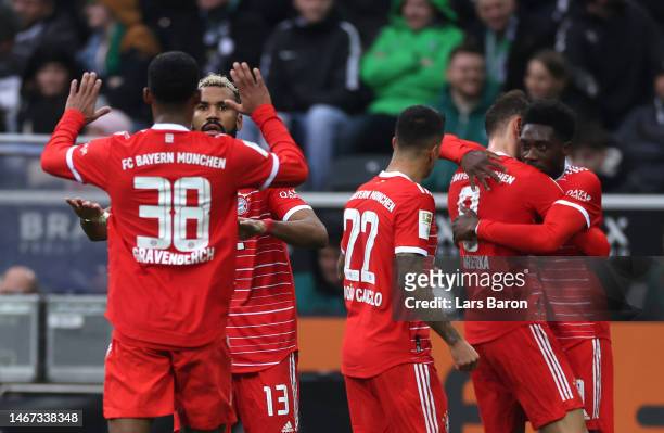 Eric Maxim Choupo-Moting of FC Bayern Munich celebrates with teammates after scoring the team's first goal during the Bundesliga match between...