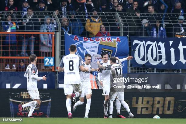 Michael Gregoritsch of Sport-Club Freiburg celebrates with teammates after scoring the team's first goal during the Bundesliga match between VfL...