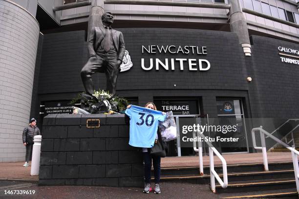 Fan is seen with a shirt of former Premier League player Christian Atsu, who was recovered from the rubble of his home in Hatay following the Turkey...