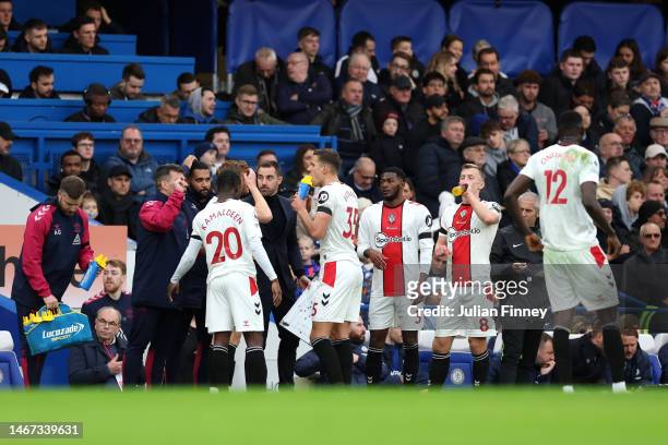 Ruben Selles, Caretaker Manager of Southampton, speaks to their players during a break in play during the Premier League match between Chelsea FC and...