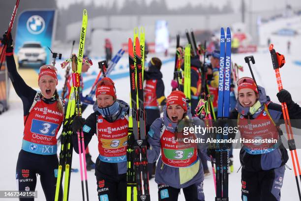 Silver medalists Denise Herrmann-Wick of Germany, Sophia Schneider of Germany, Hanna Kebinger of Germany and Vanessa Voigt of Germany celebrate after...