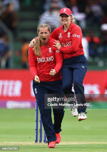Sophie Ecclestone of England celebrates the wicket of Harmanpreet Kaur of India with team mate Charlie Dean during the ICC Women's T20 World Cup...