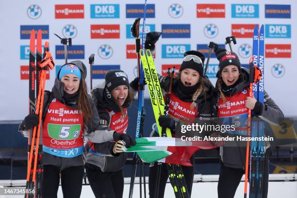 Gold medalists Dorothea Wierer of Italy, Samuela Comola of Italy, Hannah Auchentaller of Italy and Lisa Vittozzi of Italy celebrate during the...