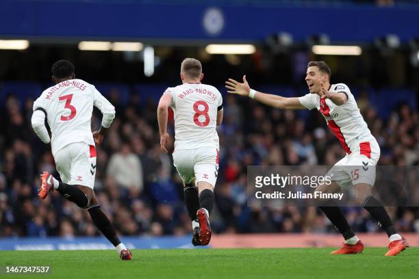 James Ward-Prowse of Southampton celebrates after scoring the team's first goal from a free kick with teammates Ainsley Maitland-Niles and Romain...