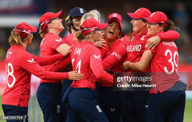 Players of England celebrate the wicket of Smriti Mandhana of India during the ICC Women's T20 World Cup group B match between England and India at...