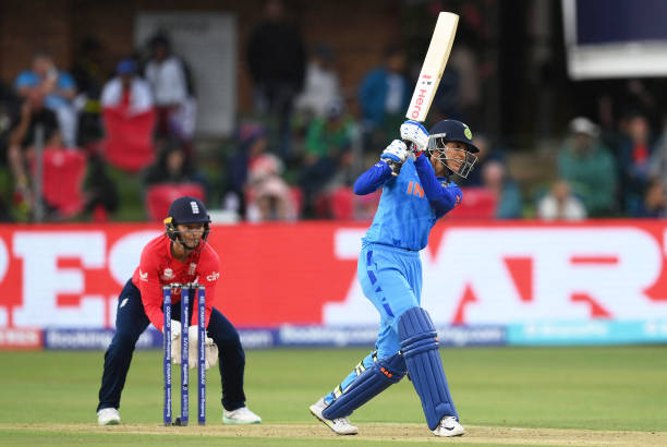 Smriti Mandhana of India plays a shot as Amy Jones of England keeps during the ICC Women's T20 World Cup group B match between England and India at...
