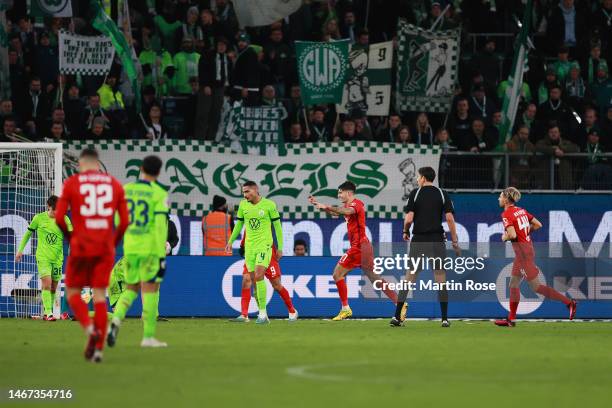 Dominik Szoboszlai of RB Leipzig celebrates after scoring the team's third goal during the Bundesliga match between VfL Wolfsburg and RB Leipzig at...