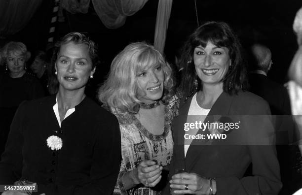 Model Lauren Hutton, actress Monica Vitti, and model Anjelica Huston attend dinner party after 'Made in Milan' film screening. The film is directed...