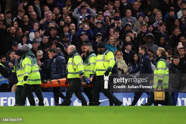 Cesar Azpilicueta of Chelsea is stretchered off after leaving the field following medical treatment after a potential head injury during the Premier...