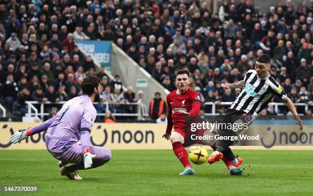 Miguel Almiron of Newcastle United has his shot saved by Alisson Becker of Liverpool during the Premier League match between Newcastle United and...