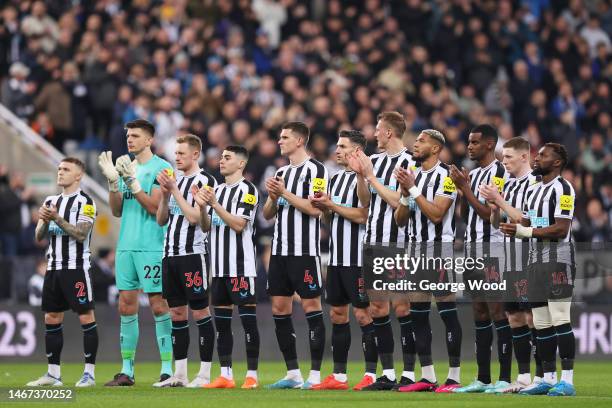 Newcastle United players applaud after a minutes silence in memory of former Premier League player Christian Atsu, who was recovered from the rubble...