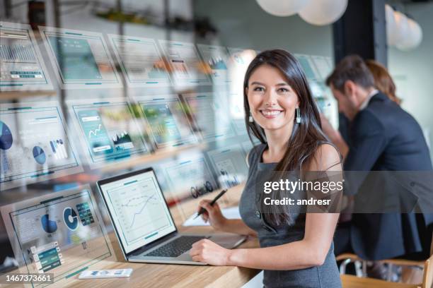 business woman using technology while working at a cafe - big data management bildbanksfoton och bilder