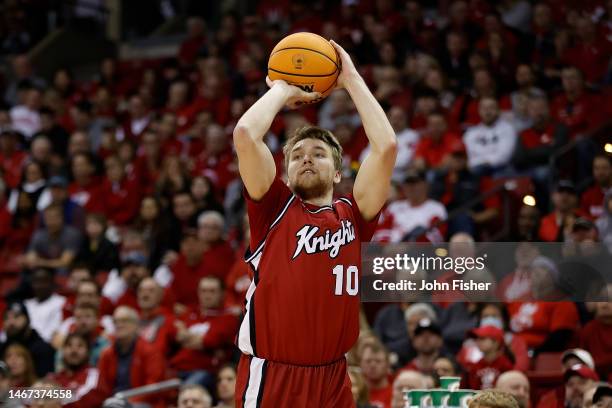 Cam Spencer of the Rutgers Scarlet Knights hits a jump shot during the first half of the game against the Wisconsin Badgers at Kohl Center on...